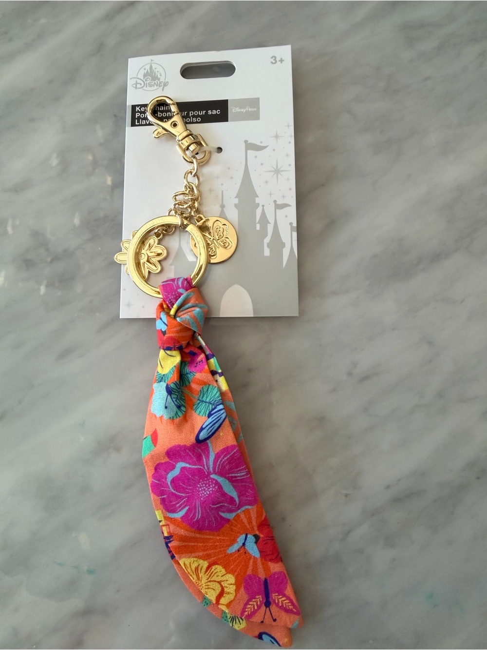 Disney Gold Keychain with Orange Multi Floral Scarf